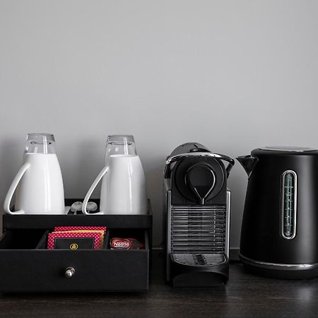 Oakwood Premier Melbourne Aparthotel Exterior foto A Nespresso coffee machine in a hotel room