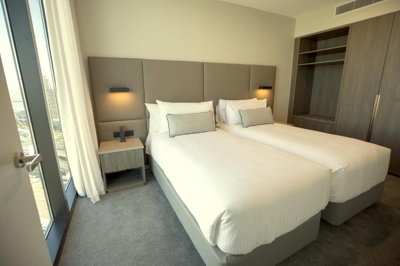 Oakwood Premier Melbourne Aparthotel Exterior foto A bedroom at the hotel